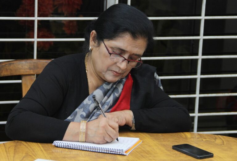 Professor Dr. Rowshan Ara Begum, Founder and Chairperson of Sahera Hasan Memorial Trust, consulting a patient at the Manikganj hospital